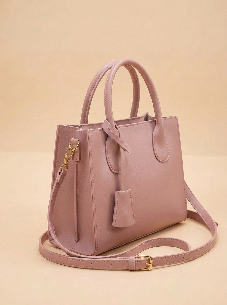 Dusty pink structured top-handle handbag, three-quarter side angle